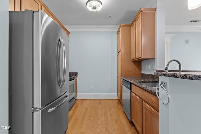 735 Portstewart Dr, Cary, NC 27519 - kitchen with appliances with stainless steel finishes, crown molding, dark stone countertops, light wood-style flooring, and baseboards