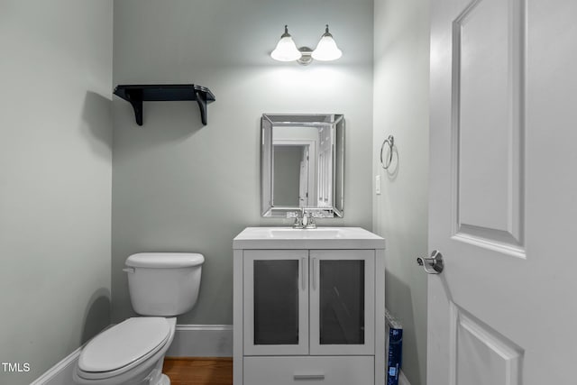 735 Portstewart Dr, Cary, NC 27519 - bathroom with toilet, vanity, wood finished floors, and baseboards