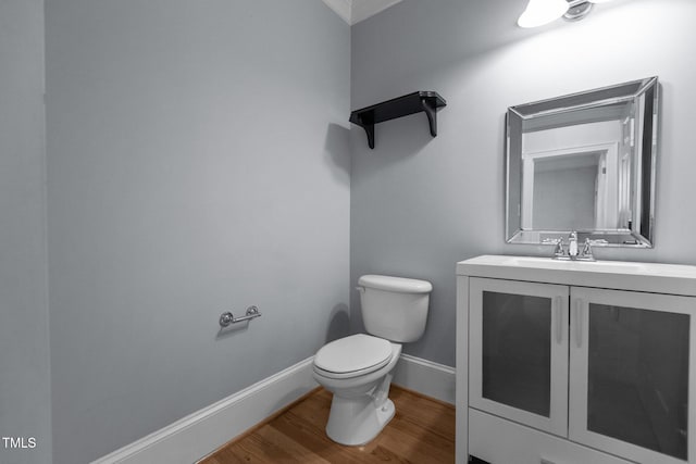 735 Portstewart Dr, Cary, NC 27519 - bathroom featuring toilet, wood finished floors, baseboards, and vanity
