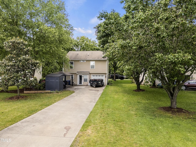 view of front of property with a storage shed, concrete driveway, a front yard, an attached garage, and an outdoor structure