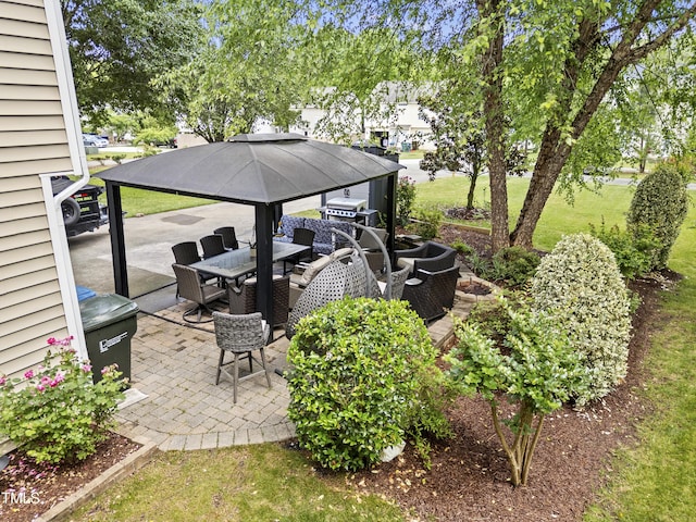 view of patio / terrace featuring outdoor dining space and a gazebo
