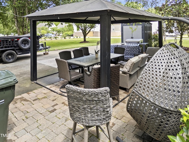 view of patio featuring outdoor dining area and a gazebo