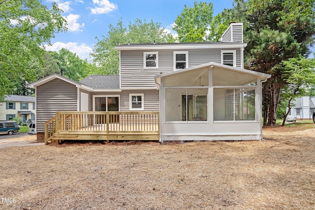 3700 Summer Pl, Raleigh, NC 27604 - back of property with a sunroom, a chimney, a deck, and a shingled roof