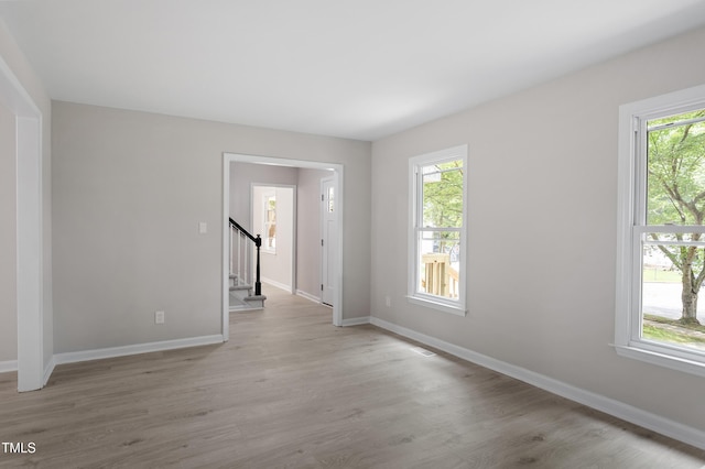 3700 Summer Pl, Raleigh, NC 27604 - empty room with stairway, baseboards, and light wood-type flooring