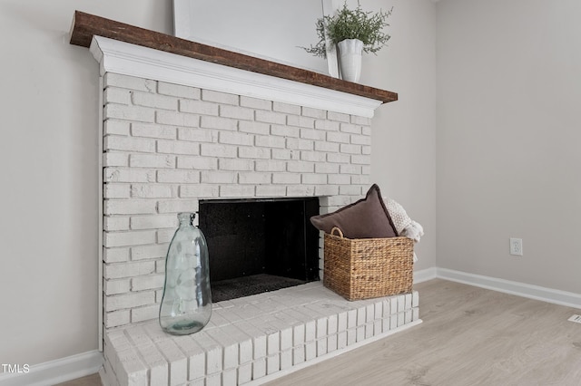 3700 Summer Pl, Raleigh, NC 27604 - detailed view of a fireplace, wood finished floors, and baseboards