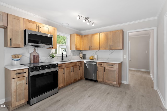 3700 Summer Pl, Raleigh, NC 27604 - kitchen featuring stainless steel appliances, a sink, light wood-style floors, light countertops, and crown molding