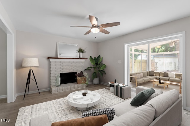 3700 Summer Pl, Raleigh, NC 27604 - living area with a ceiling fan, wood finished floors, baseboards, and a brick fireplace