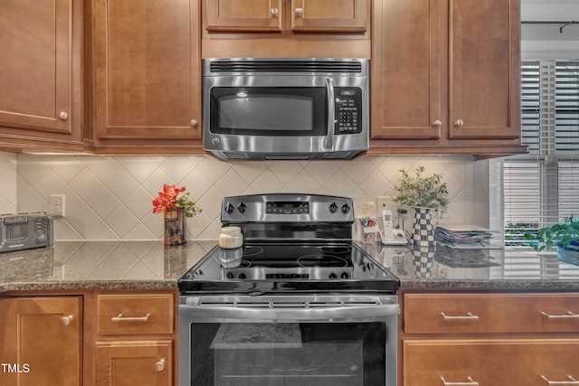 79 Heatherwood Dr, Chapel Hill, NC 27516 - kitchen featuring stainless steel appliances, dark stone countertops, and backsplash