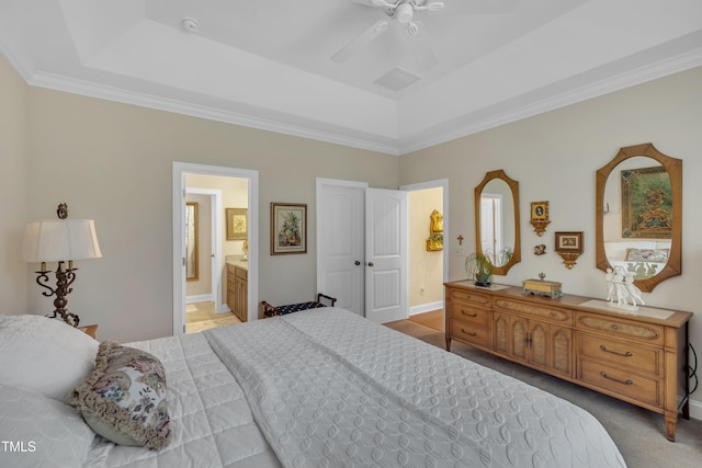 79 Heatherwood Dr, Chapel Hill, NC 27516 - bedroom featuring a tray ceiling, ornamental molding, ensuite bath, and a ceiling fan