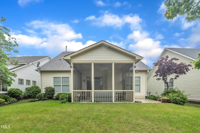 79 Heatherwood Dr, Chapel Hill, NC 27516 - back of house with a sunroom, roof with shingles, and a lawn