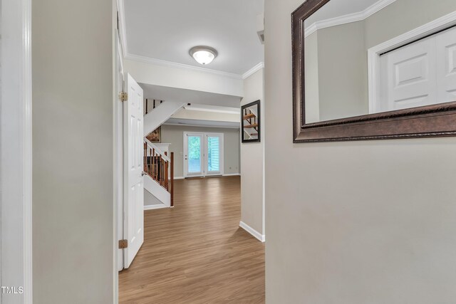 134 Riverwalk Cir, Cary, NC 27511 - corridor featuring ornamental molding, wood finished floors, baseboards, and stairway