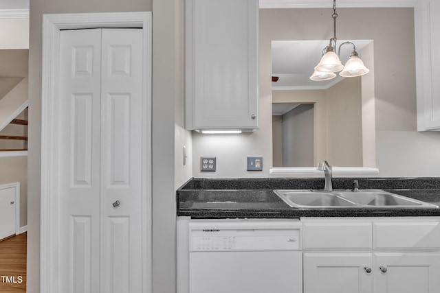 134 Riverwalk Cir, Cary, NC 27511 - kitchen with white dishwasher, a sink, white cabinetry, pendant lighting, and crown molding