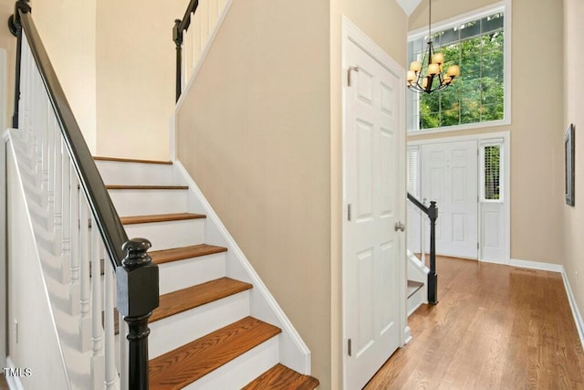 100 Wentbridge Rd, Cary, NC 27519 - entryway featuring a chandelier, stairway, light wood-style floors, and baseboards