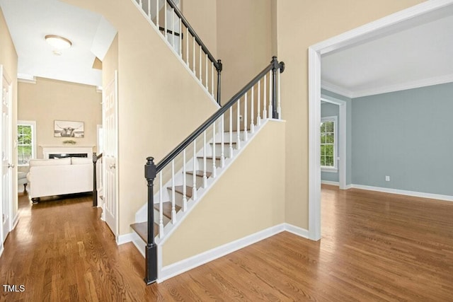100 Wentbridge Rd, Cary, NC 27519 - staircase with wood finished floors, ornamental molding, and baseboards