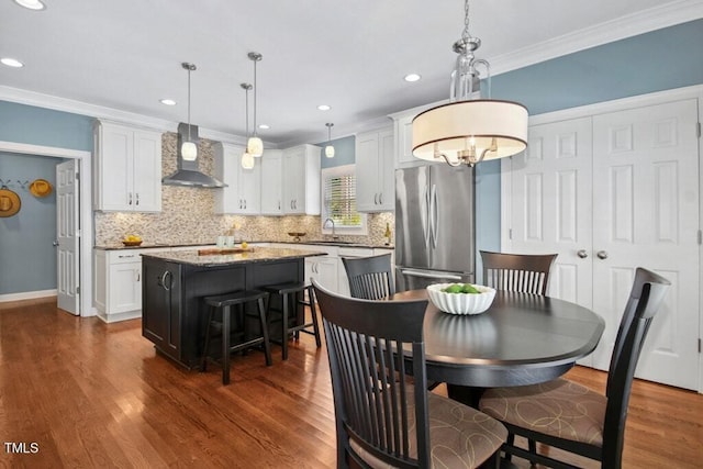 100 Wentbridge Rd, Cary, NC 27519 - dining area featuring ornamental molding, dark wood-style flooring, recessed lighting, and baseboards