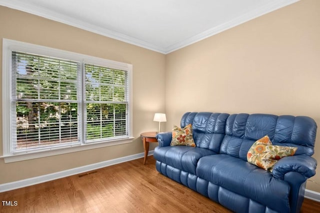 100 Wentbridge Rd, Cary, NC 27519 - living area with healthy amount of natural light, baseboards, crown molding, and wood finished floors