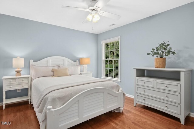 100 Wentbridge Rd, Cary, NC 27519 - bedroom with wood finished floors, baseboards, and a ceiling fan