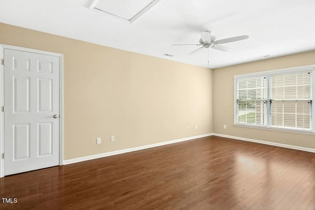 100 Wentbridge Rd, Cary, NC 27519 - unfurnished room featuring dark wood finished floors, baseboards, a ceiling fan, and attic access