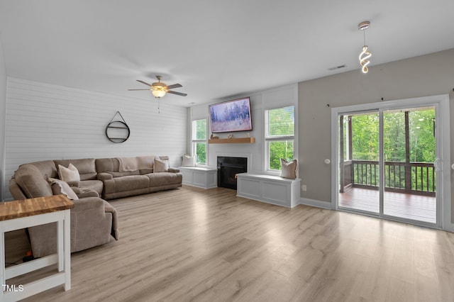 55 Prospectus Ln, Franklinton, NC 27525 - living room with a ceiling fan, light wood finished floors, a fireplace, and baseboards