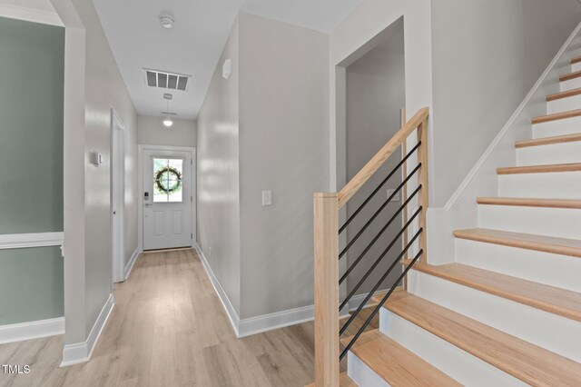 55 Prospectus Ln, Franklinton, NC 27525 - foyer featuring wood finished floors, stairs, and baseboards