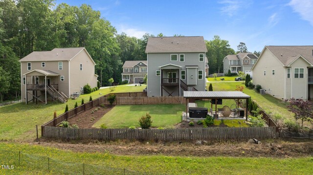 55 Prospectus Ln, Franklinton, NC 27525 - back of property featuring a hot tub, stairs, a residential view, and a patio area