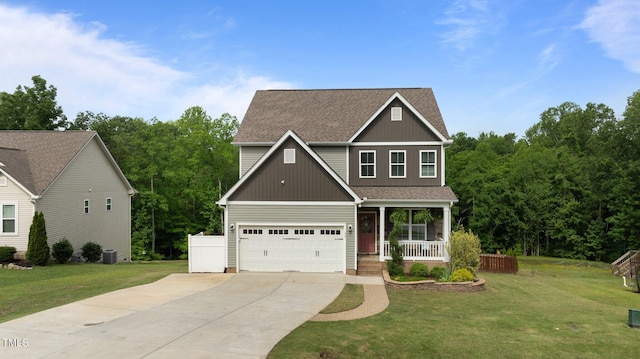 55 Prospectus Ln, Franklinton, NC 27525 - view of front of home featuring driveway, covered porch, roof with shingles, a front yard, and central air condition unit