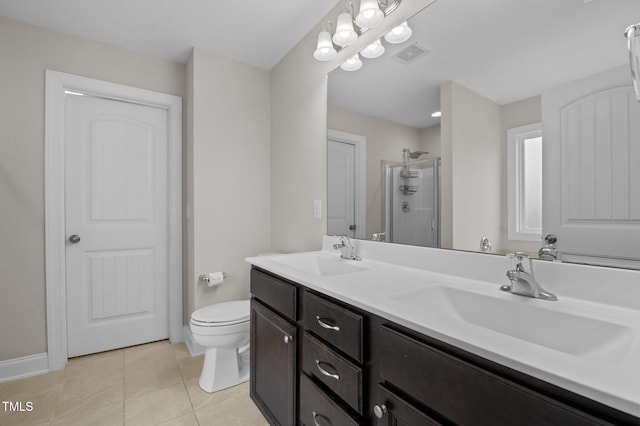 55 Prospectus Ln, Franklinton, NC 27525 - bathroom featuring a shower stall, tile patterned flooring, toilet, double vanity, and baseboards