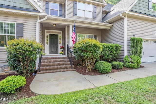 68 Tanners Way, Clayton, NC 27527 - view of exterior entry featuring a garage