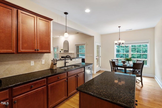 68 Tanners Way, Clayton, NC 27527 - kitchen featuring stainless steel dishwasher, a sink, backsplash, plenty of natural light, and recessed lighting