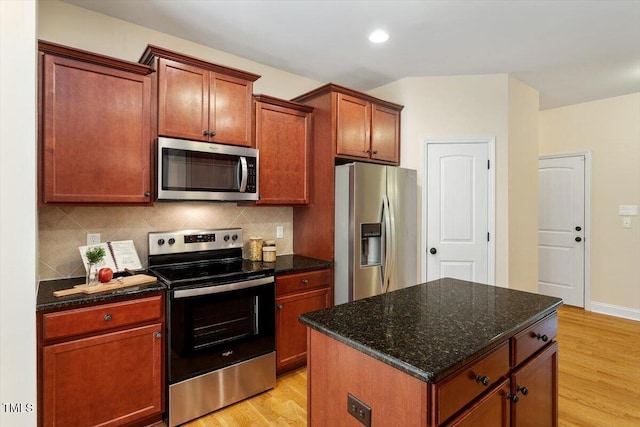 68 Tanners Way, Clayton, NC 27527 - kitchen featuring stainless steel appliances, light wood finished floors, backsplash, and recessed lighting