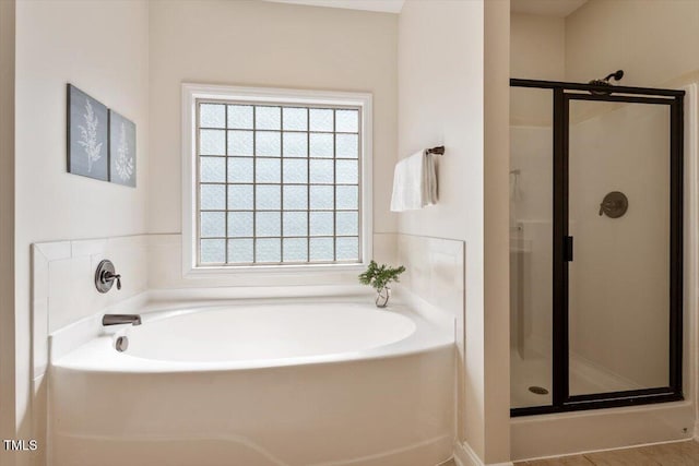 68 Tanners Way, Clayton, NC 27527 - bathroom featuring healthy amount of natural light, a shower stall, and a garden tub