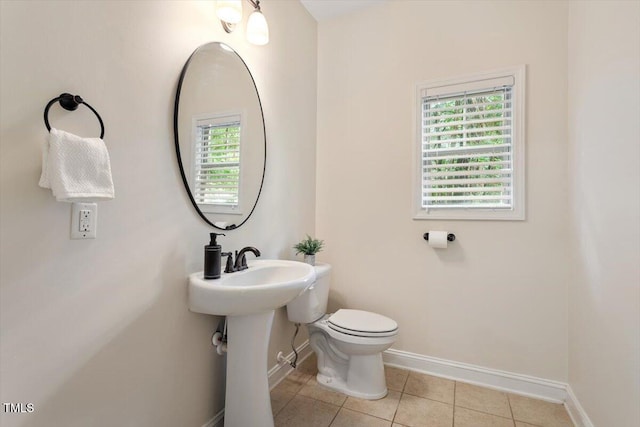 68 Tanners Way, Clayton, NC 27527 - bathroom featuring baseboards, toilet, and tile patterned floors