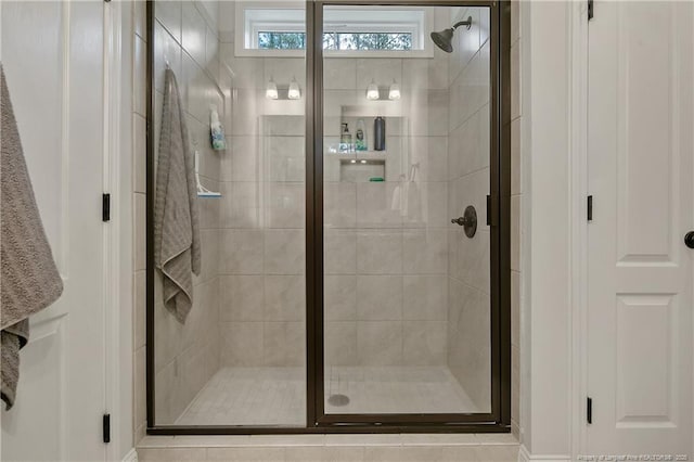 bathroom with a shower stall