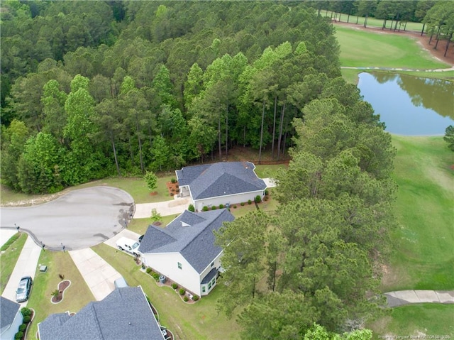 bird's eye view of a large body of water and a heavily wooded area