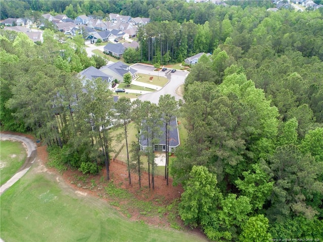 aerial view of property and surrounding area with nearby suburban area
