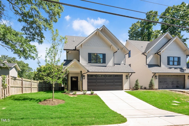 703 E Markham Ave, Durham, NC 27701 - view of front facade featuring an attached garage, driveway, and roof with shingles