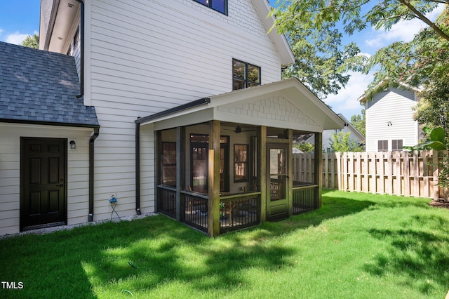 703 E Markham Ave, Durham, NC 27701 - back of house featuring a sunroom and a shingled roof