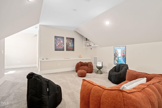 703 E Markham Ave, Durham, NC 27701 - living area with carpet flooring and vaulted ceiling