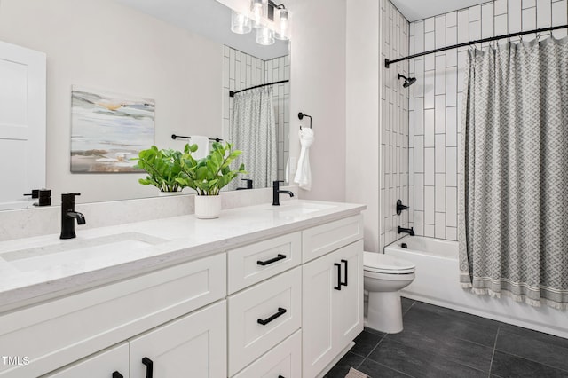 703 E Markham Ave, Durham, NC 27701 - bathroom featuring double vanity, shower / tub combo with curtain, and tile patterned floors