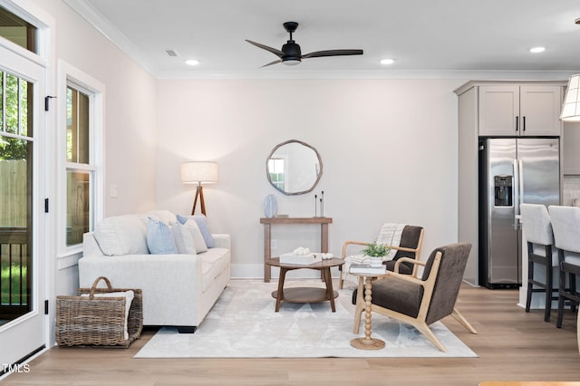 703 E Markham Ave, Durham, NC 27701 - living room featuring ornamental molding, light wood-style flooring, a ceiling fan, and recessed lighting