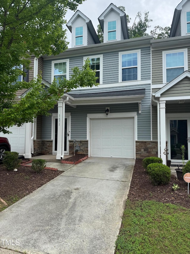 1671 Holly Grove Way, Durham, NC 27713 - view of front of home featuring stone siding, an attached garage, and concrete driveway