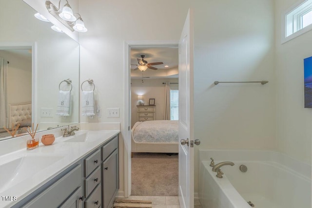 bathroom with connected bathroom, a bathtub, tile patterned floors, a ceiling fan, and double vanity