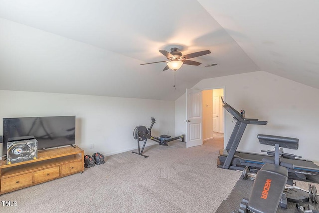 exercise area with vaulted ceiling, a ceiling fan, carpet floors, and baseboards