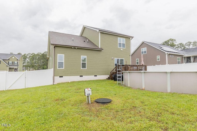back of property featuring crawl space, an outdoor pool, and a wooden deck