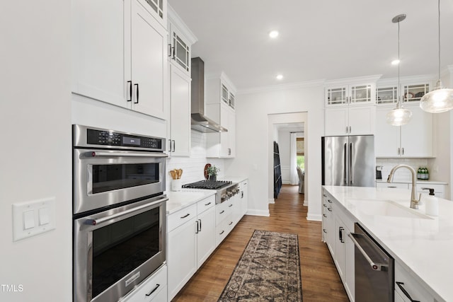 1928 Vandiver Way, Apex, NC 27523 - kitchen featuring appliances with stainless steel finishes, a sink, light countertops, tasteful backsplash, and dark wood-type flooring