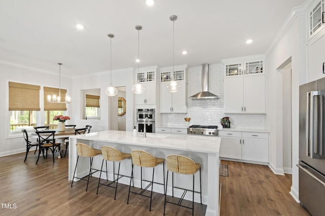 1928 Vandiver Way, Apex, NC 27523 - kitchen featuring wall chimney range hood, stainless steel appliances, a kitchen bar, a sink, and tasteful backsplash