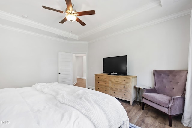 1928 Vandiver Way, Apex, NC 27523 - bedroom with a tray ceiling, wood finished floors, crown molding, and ceiling fan
