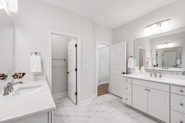 1928 Vandiver Way, Apex, NC 27523 - bathroom with marble finish flooring, two vanities, and baseboards