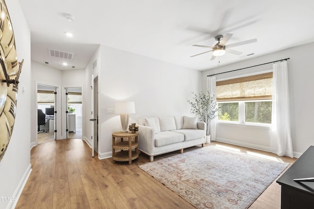 1928 Vandiver Way, Apex, NC 27523 - living room featuring light wood-style floors, ceiling fan, baseboards, and recessed lighting