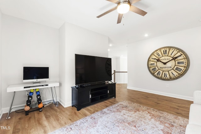 1928 Vandiver Way, Apex, NC 27523 - living room with wood finished floors, ceiling fan, baseboards, and recessed lighting
